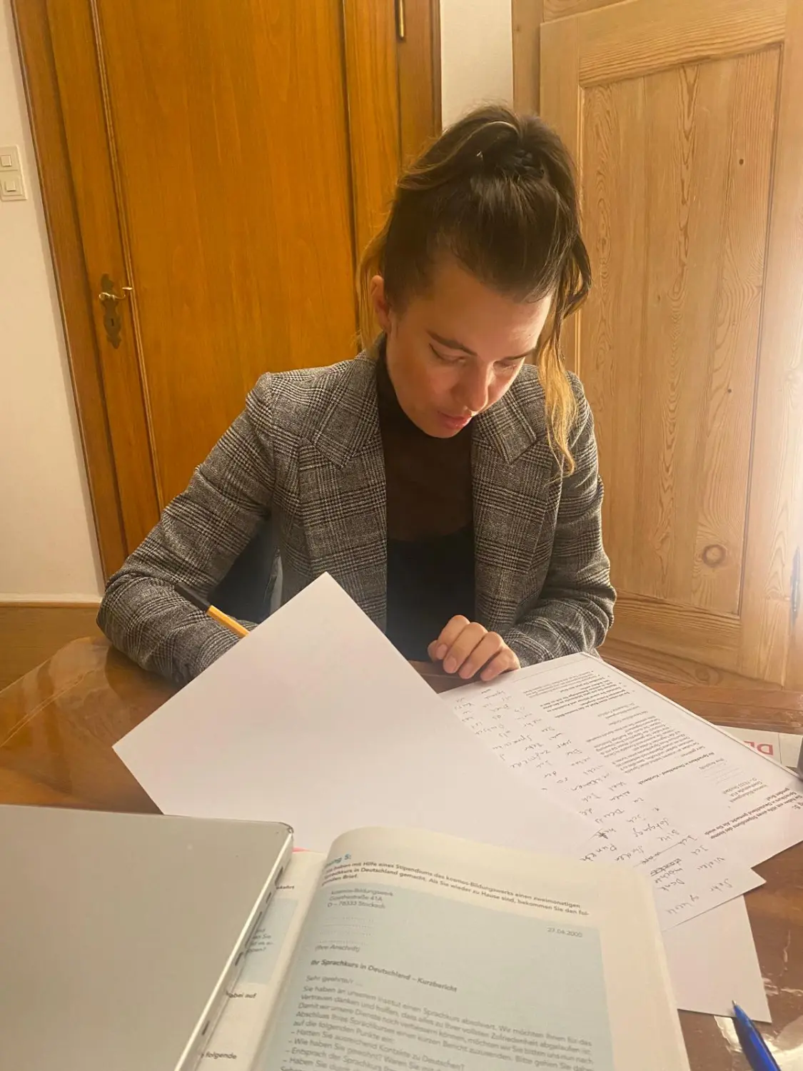 SprachHaus Bamberg - a woman working on documents